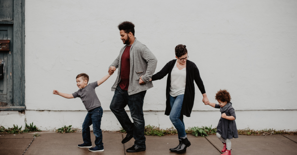 a family of 4 walking along the path