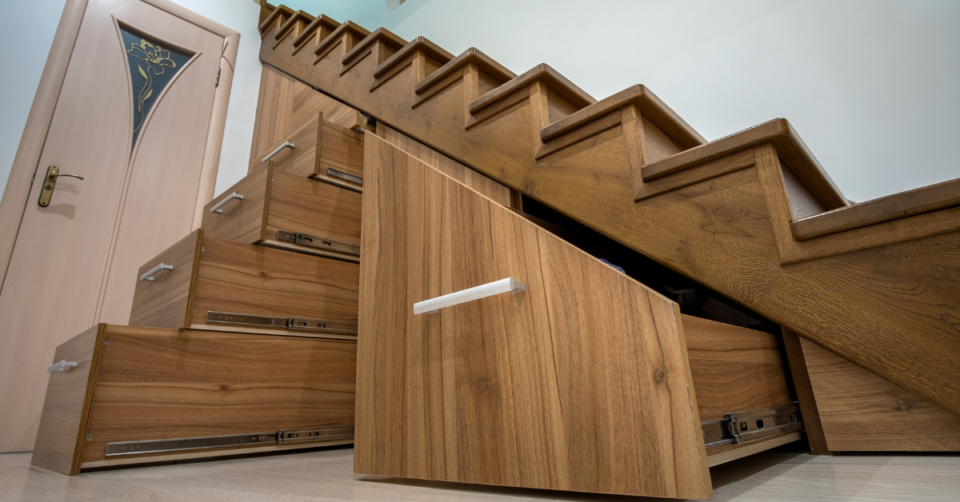 under stairs area being utilised with cupboards and drawers