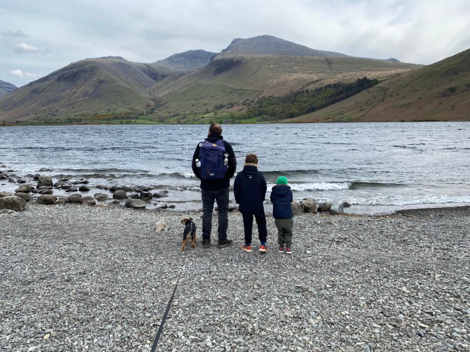 family of dad and 2 boys plus dog at the lake district