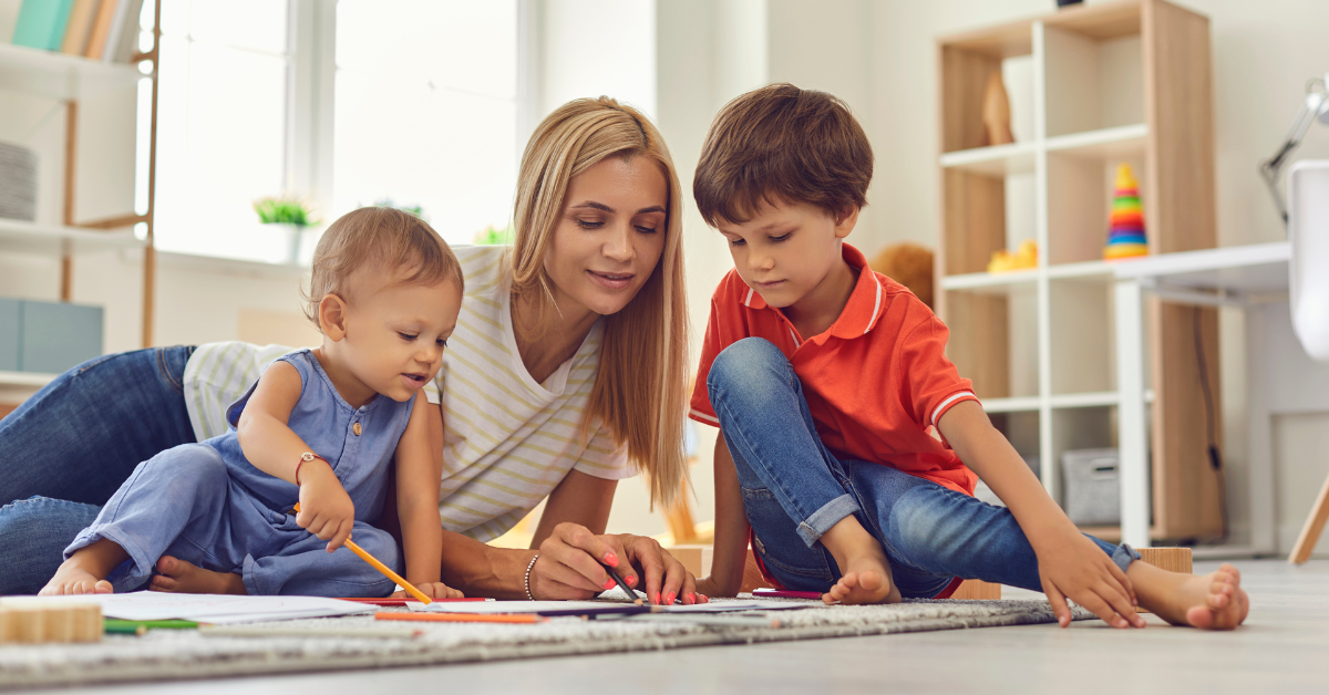 a female nanny with two kids