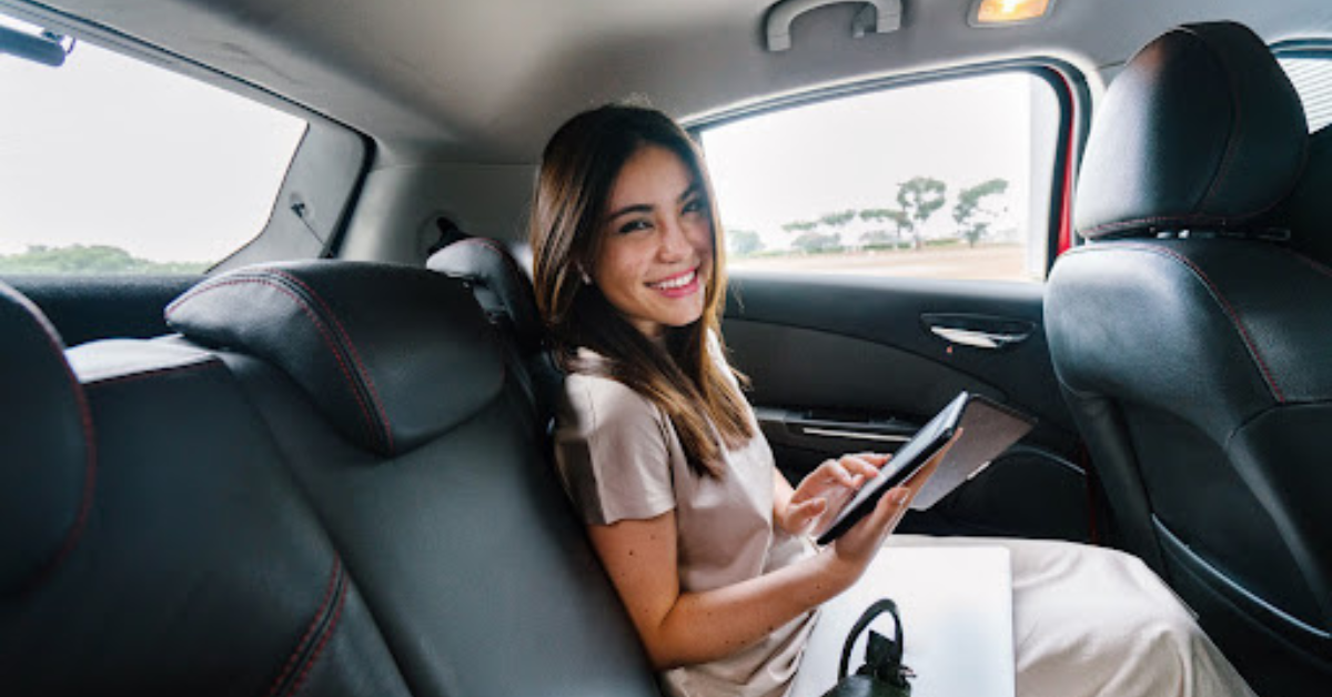 a woman in a car being productive