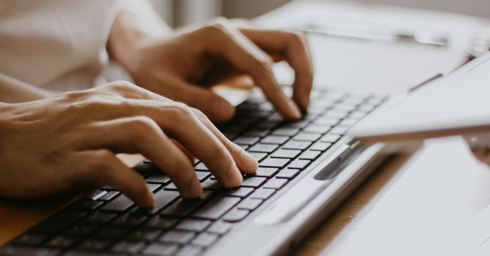 hands on a computer keyboard
