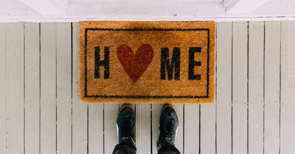 home written on a doormat