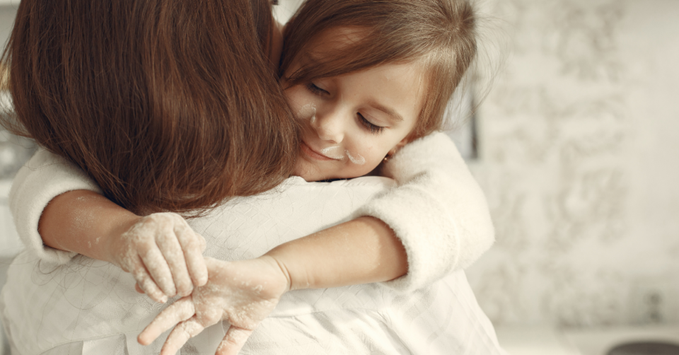 child hugging a mum