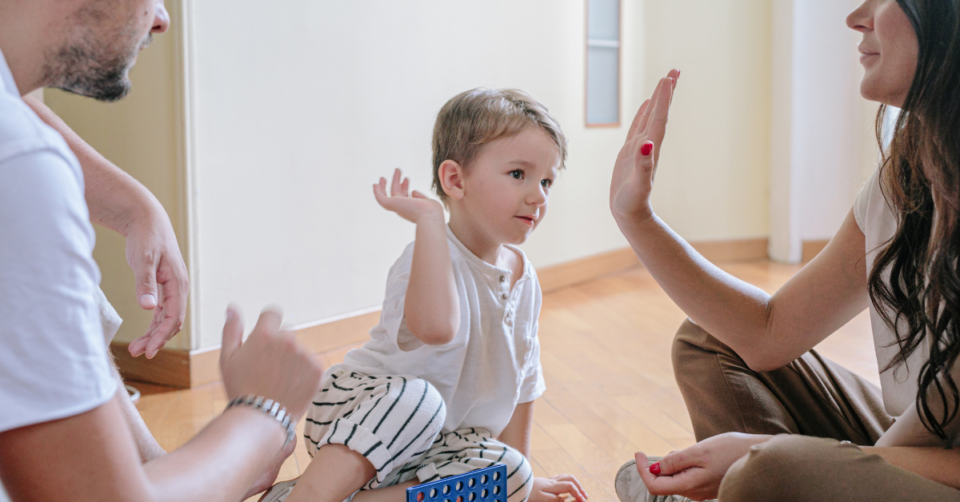 parent high fiving a kid