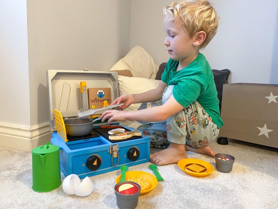 William playing with the Camp Stove in his bedroom