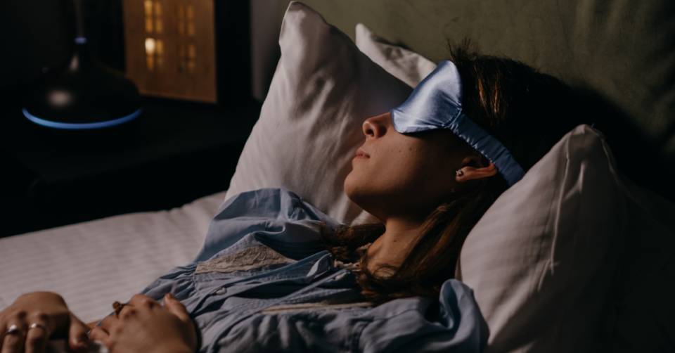 lady sleeping with eye cover on