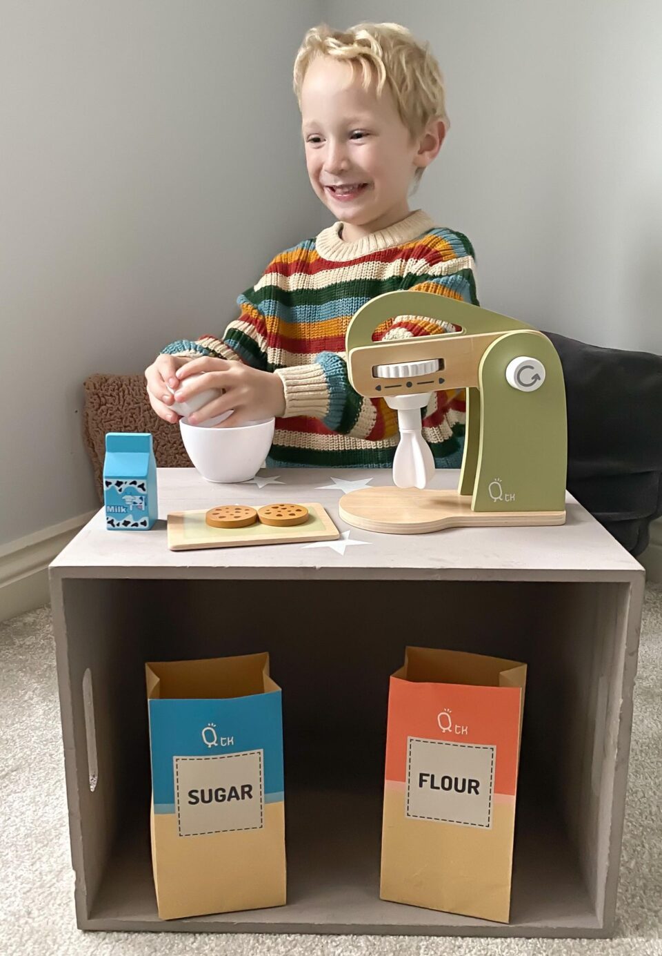 the wooden mixer beingplayed with by a child