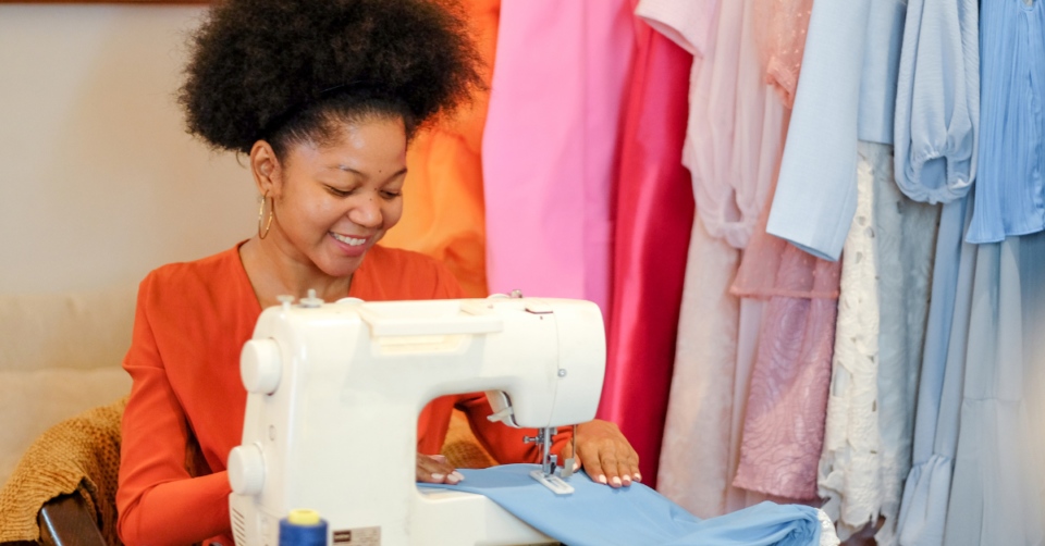 a lady using a sewing machine
