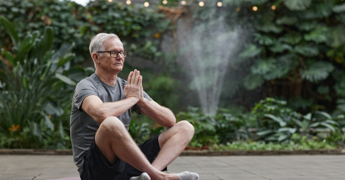 older man doing yoga