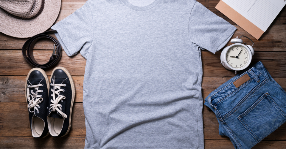 t shirt, jeans, shoes, clock and shoes laid out