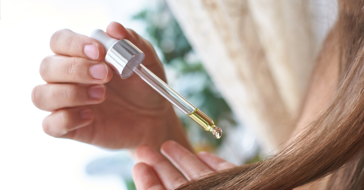 hair oil being put onto hair