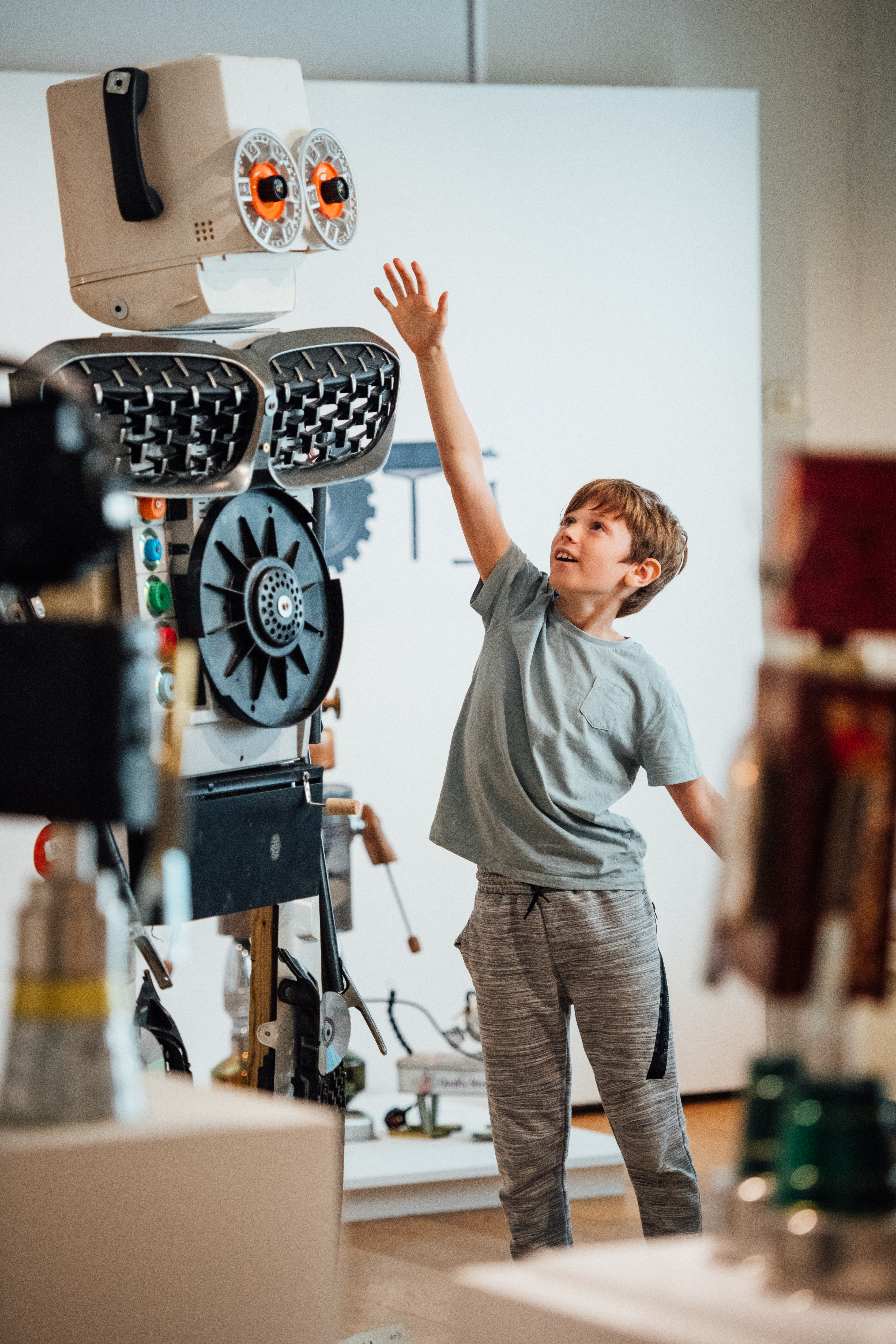 Jake reaching up to the large robot