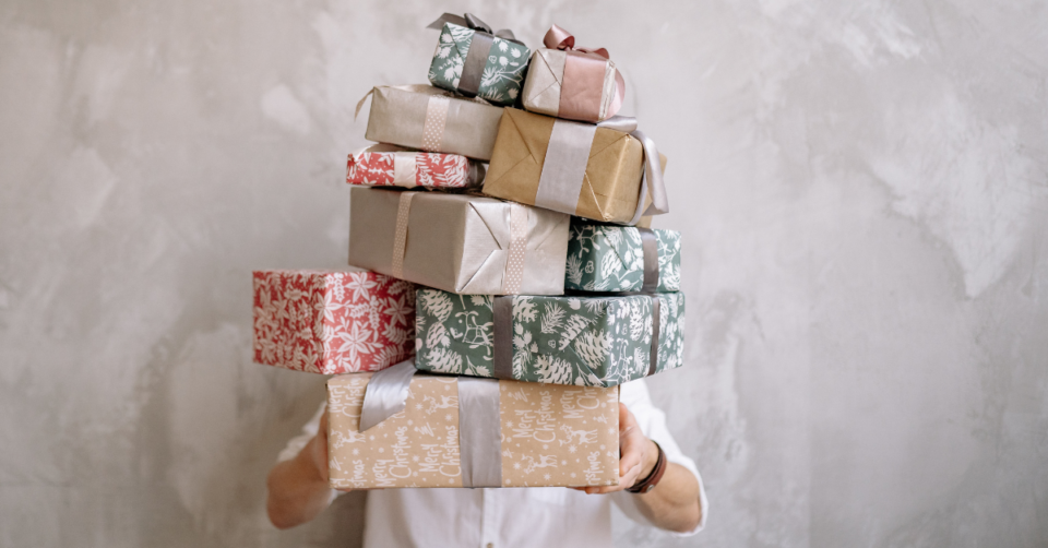 dad holding lots of gifts