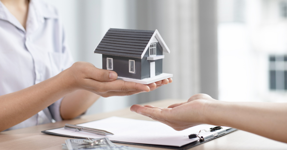 a small house being handed over