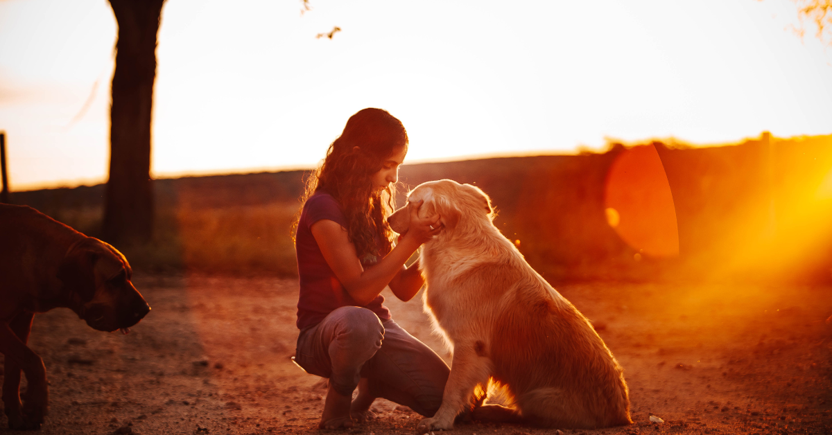 a woman with a retriever