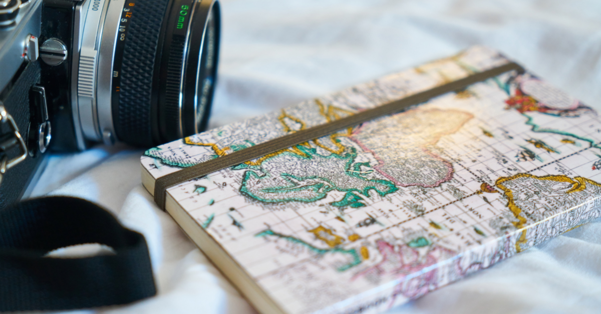 a map notebook and camera