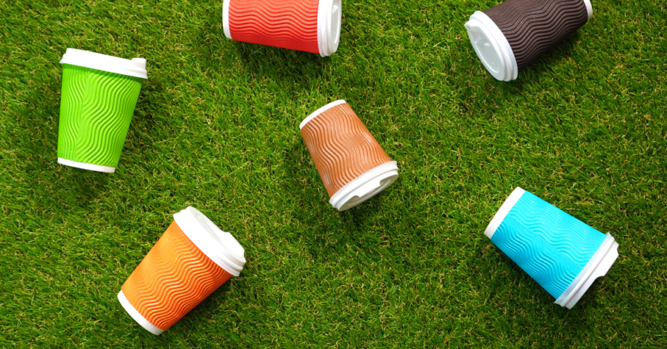 plastic cups on top of plastic grass