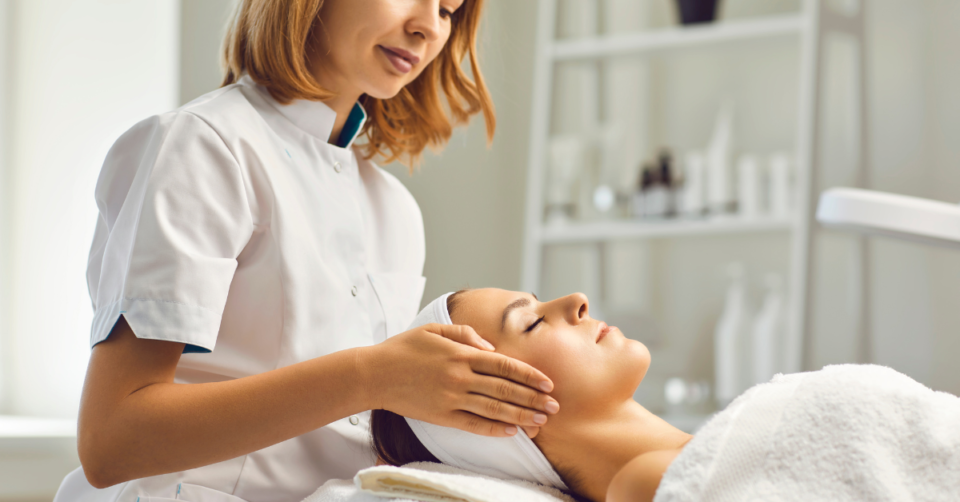 a beautician giving a facial