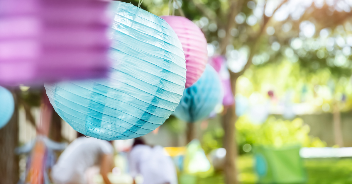 reusable party decorations hanging up at an outdoor party