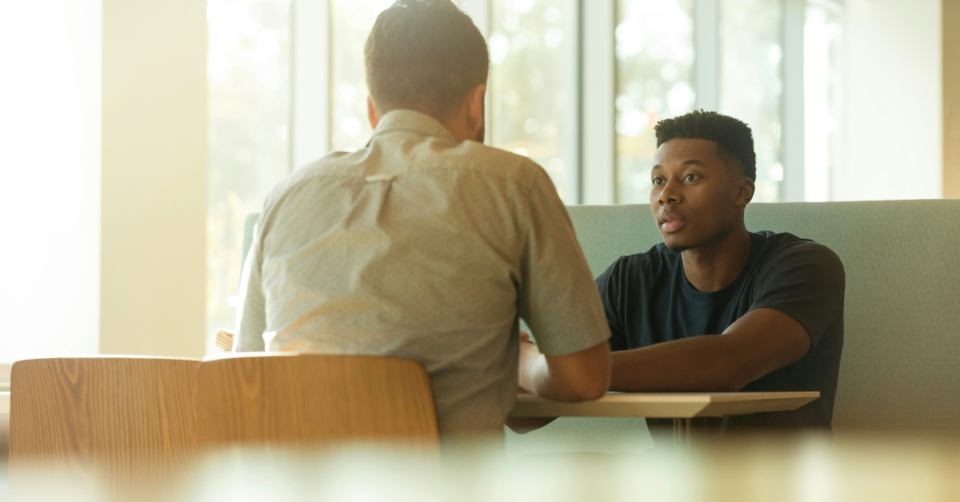 two men talking