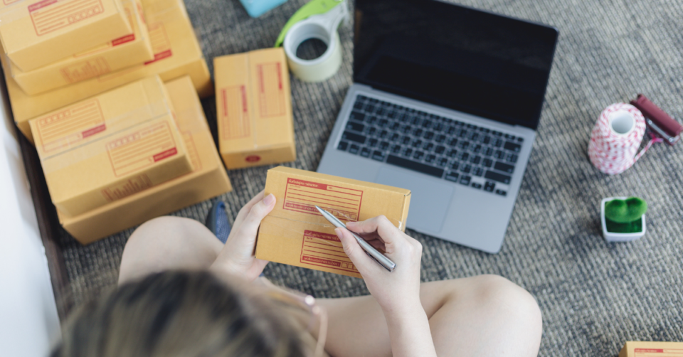 selling online showing boxes and a laptop