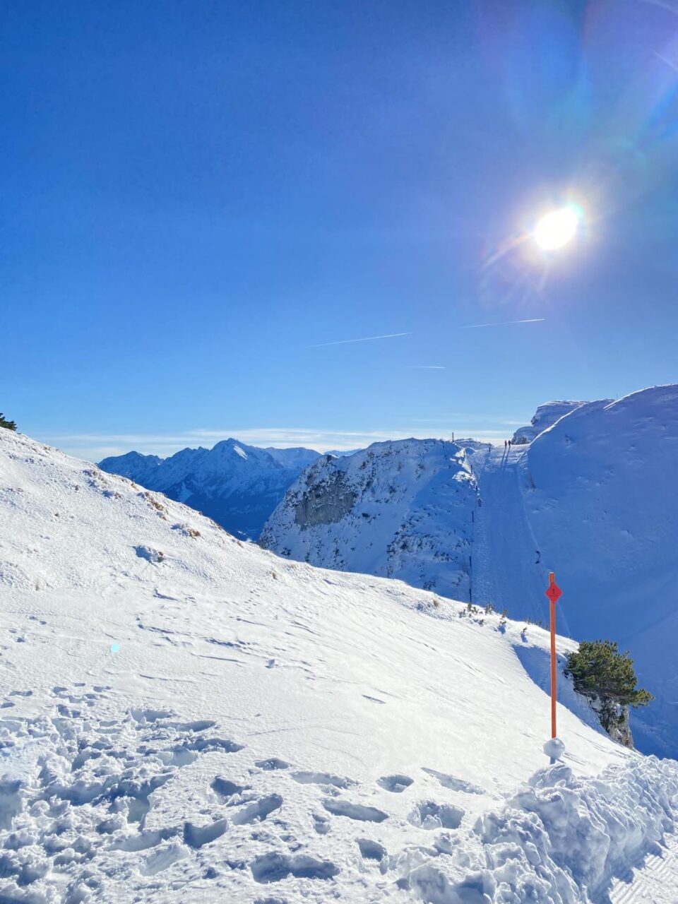 the sun and snow on the mountain