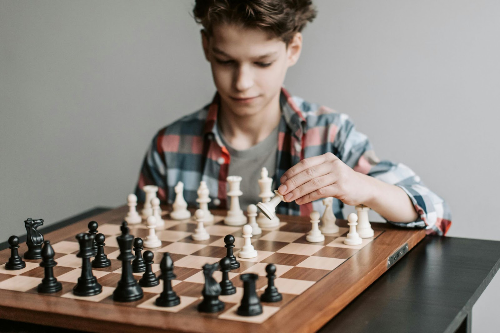 a boy playing chess