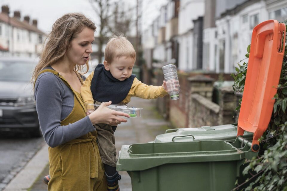 a mother recycling with her child