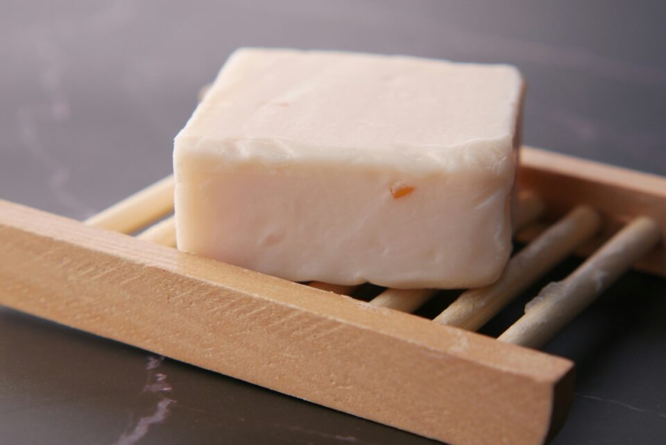 shampoo bar on a wooden slatted soap holder