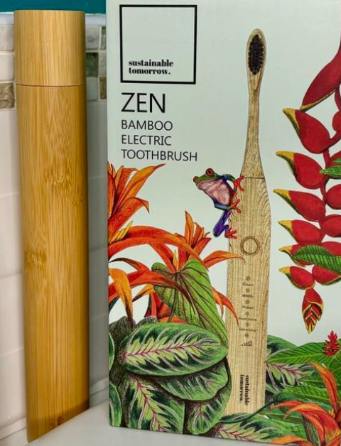 Zen Bamboo electric toothbrush with case sat on a bathroom sink