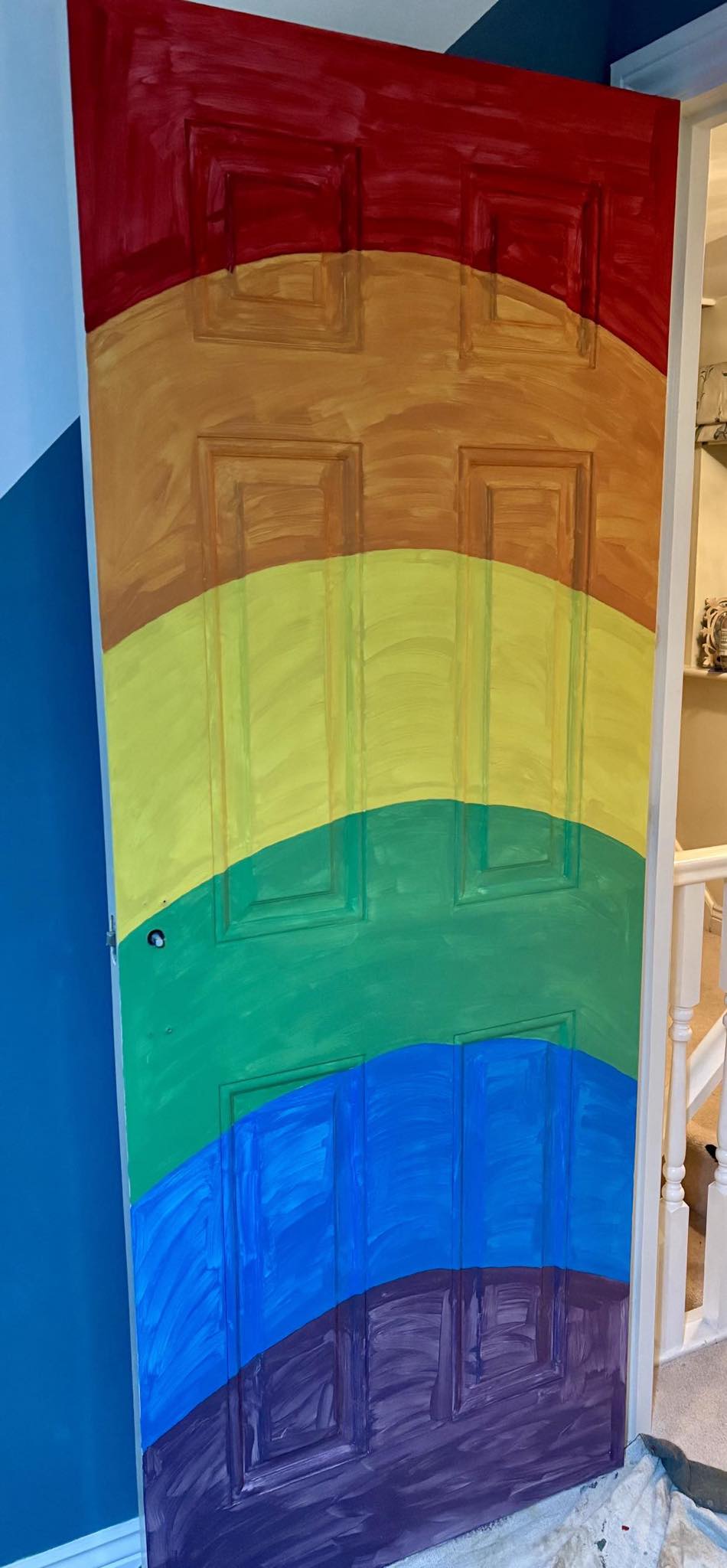 th rainbow door with the first coat of paint