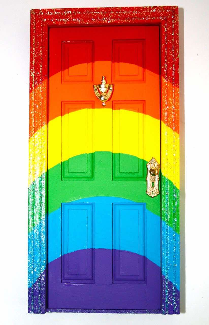 a rainbow door with glitter