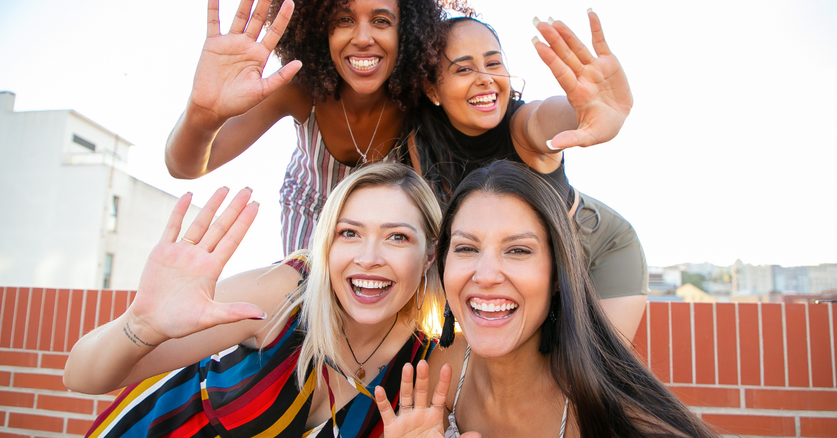 4 ladies smiling