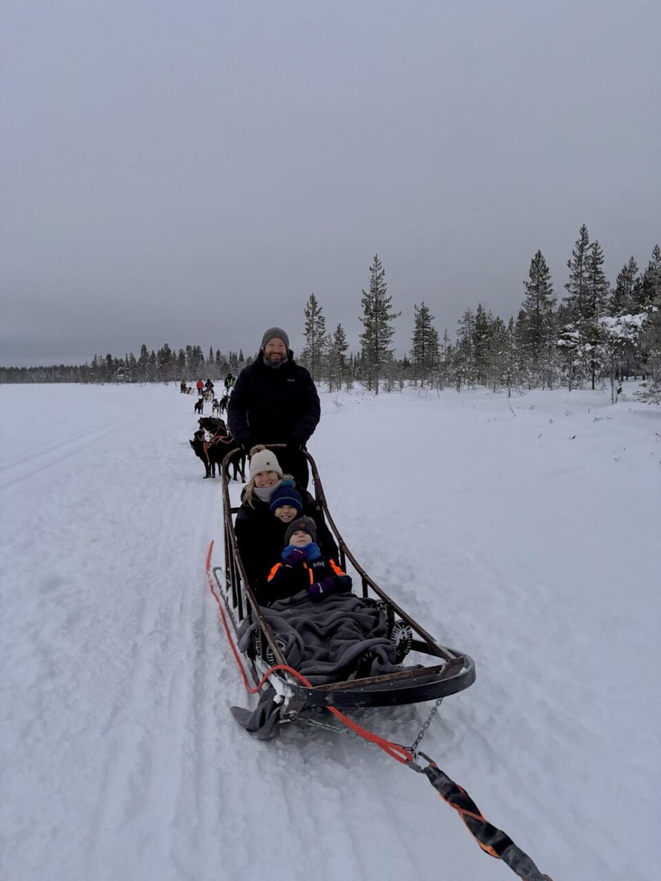 all of us 4 on the husky sled in lapland