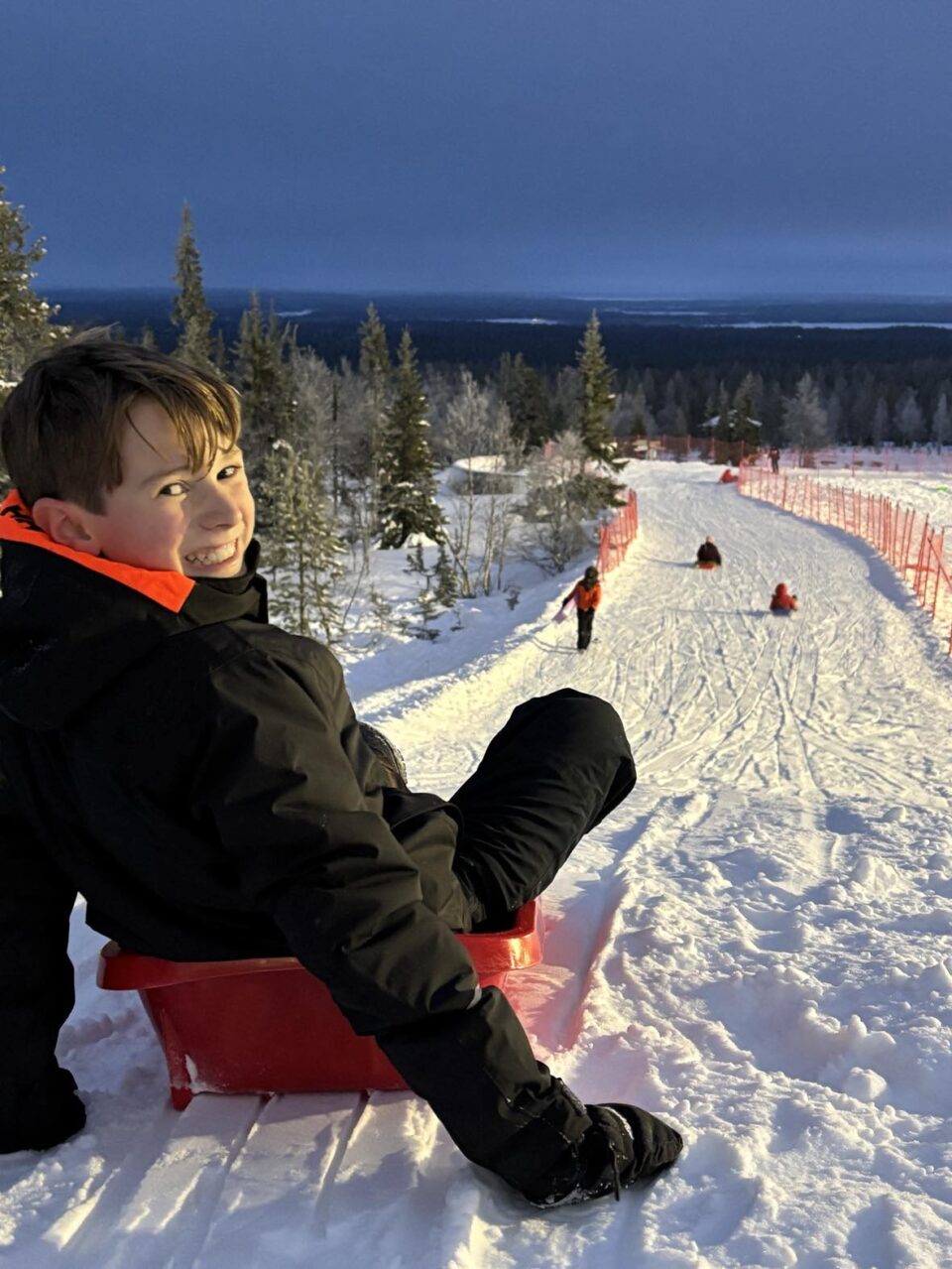 child on sledge at Yllas ski resort