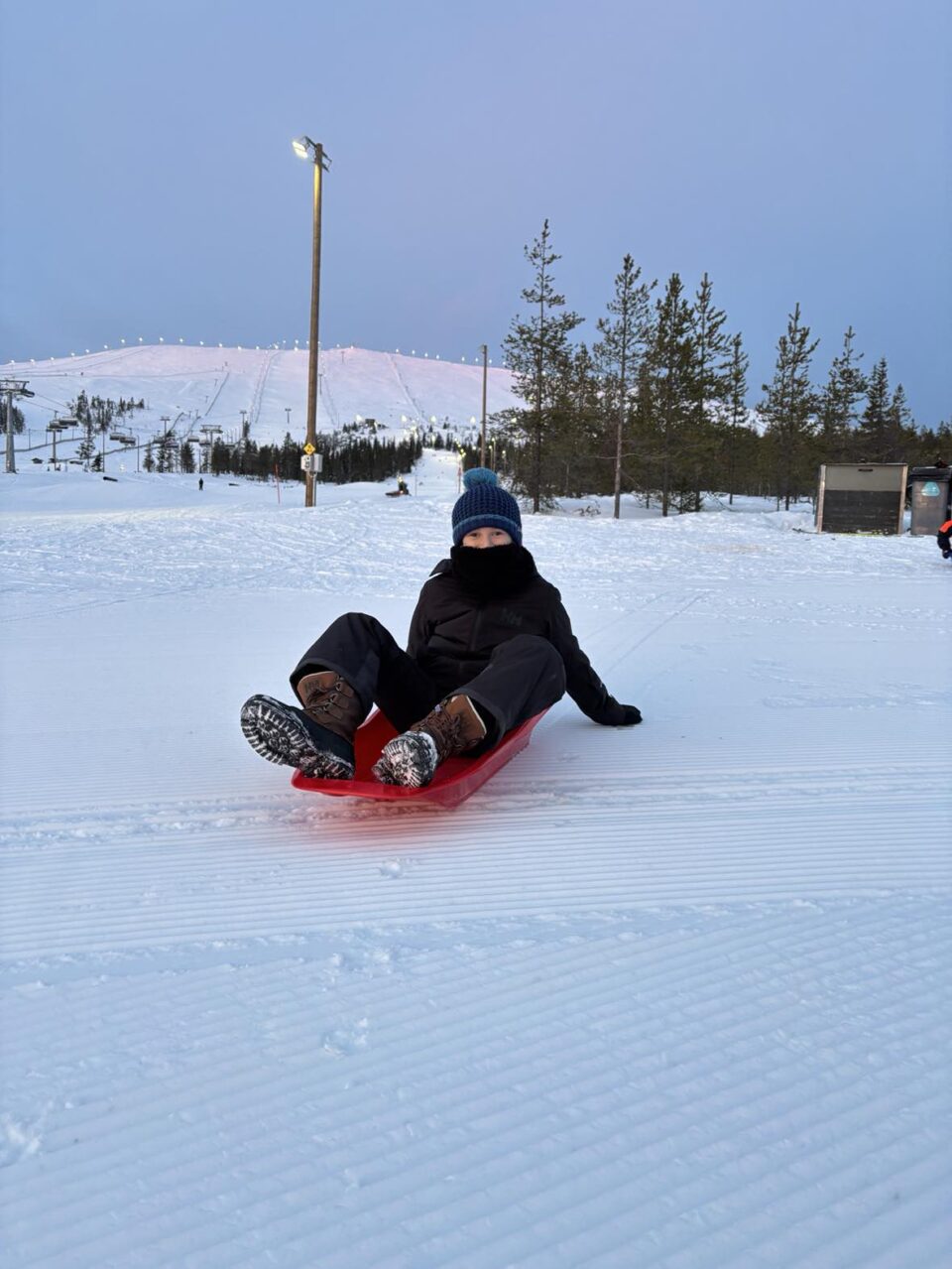 Jake on a sledge at Yllas ski resort