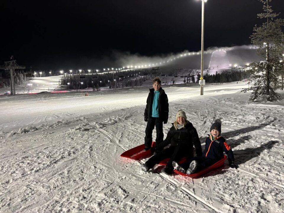 me and my two kids on sledges at Yllas ski resort