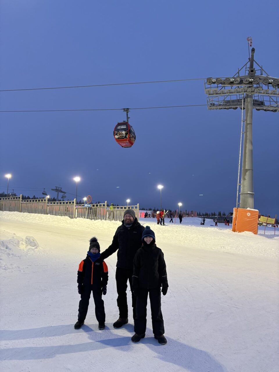 dad and two kids at ski resort