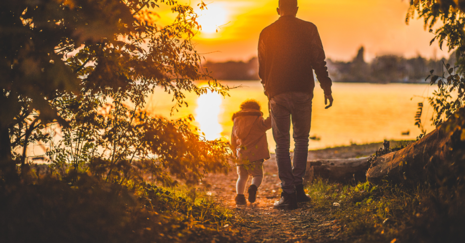 dad and child at sunset