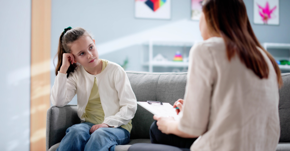 a child being spoken to someone in mental health