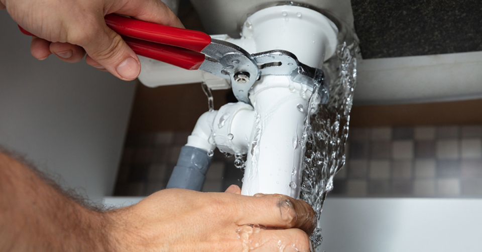 a leak under a sink being fixed