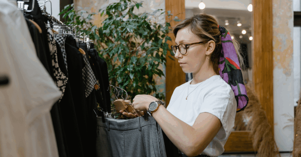 a woman shopping for trousers
