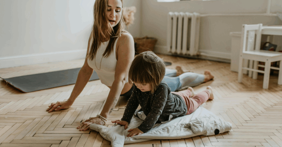 mum and kid doing yoga