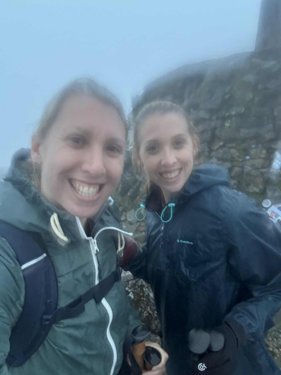 a slightly blurry picture due to the rain of me and my sister
