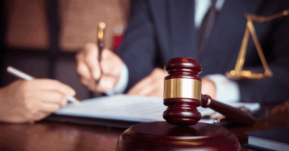 two people signing legal documents