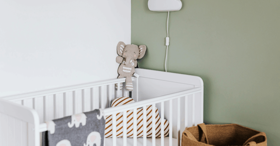 a nursery with a baby bed