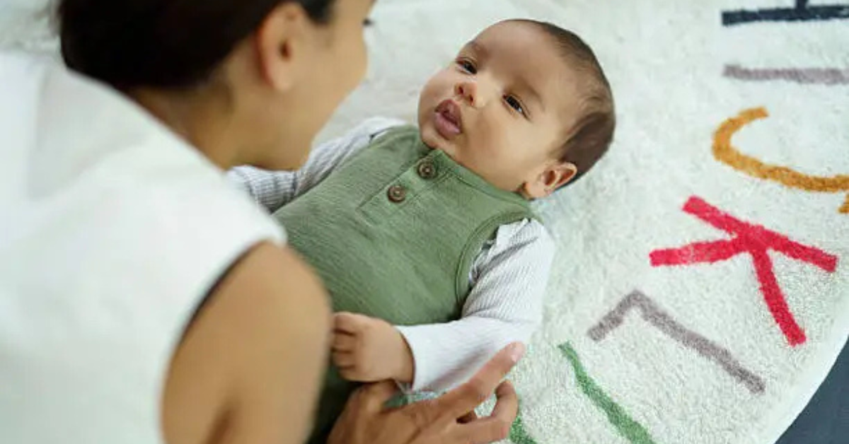 a baby looking like it's trying to speak