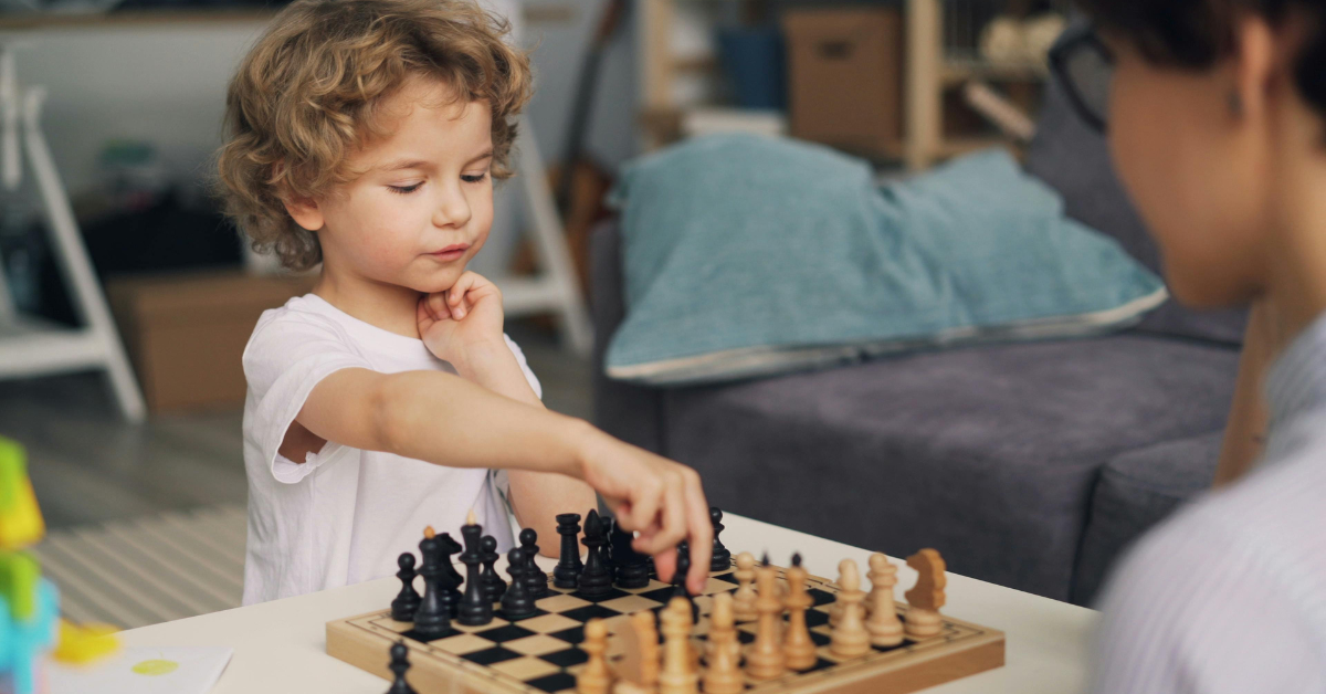 a kid playing chess
