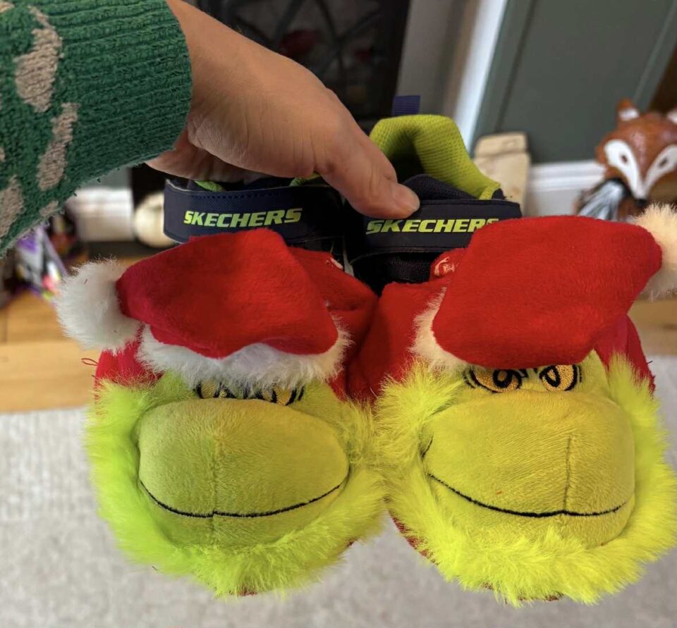the grinch slippers over the top of shoes